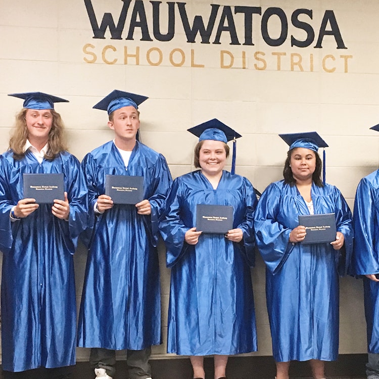 Woman teaching others using a white board